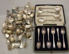 A large collection of various commemorative spoons in silver,