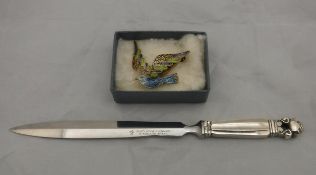 A George Jensen silver handled paperknife together with a enamelled filigree work "Dove" brooch