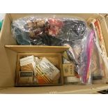 A box containing assorted boxes and baskets of knitting and sewing patterns,
