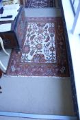 A Persian style rug,