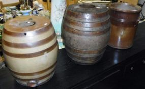 Three various stoneware barrels and a stoneware jar