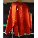 A red silk Chinese jacket with pale blue lining and a box containing various linen and lace trim
