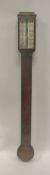 A 19th Century mahogany cased stick barometer with mercury thermometer and barometer,
