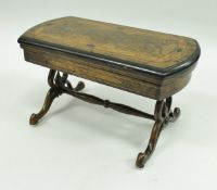 A Victorian miniature walnut and inlaid fold over games table opening to reveal a tooled and gilded