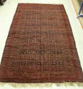 A Belouch carpet, the central panel set with tiled design on a black ground,