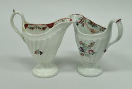 Two 18th Century Newhall porcelain cream jugs of helmet form,