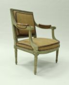 A pair of early 19th Century French carved and painted framed elbow chairs in the Louis XVI taste