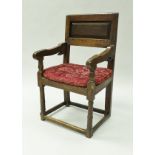 An 18th Century oak armchair,