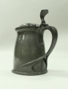 A Liberty tudric pewter tankard with sinuous handle stamped "tudric" and numbered to base 0-066