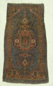 A Caucasian rug, the central panel set with geometric patterned medallion,