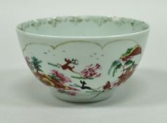 An 18th Century Worcester Dr Wall period porcelain tea bowl with panels decorated with chinoiserie