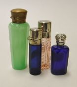 A collection of four coloured glass scent bottles,