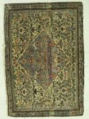 A fine Persian carpet, the central panel set with a floral decorated medallion on a beige ground,