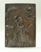 A carved oak panel depicting Abraham sacrificing Isaac with an angel in the sky above,