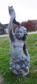 A 20th Century lead fountain head in the Classical manner depicting a figure holding aloft a fish,