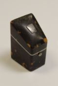 A 19th Century tortoiseshell needle case of knife box form, the top set with white metal escutcheon,