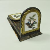 A Victorian coromandel adjustable bookstand the folding domed ends with gilt brass framed pietra