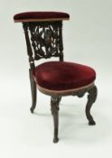 A 19th Century Black Forest carved oak prie à Dieu chair with carved dead game decoration,