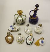 A collection of seven various printed and painted decorated scent bottles, three of heart design,
