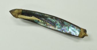 A New Zealand Maori fishing lure, abalone (paua) shell and bone with sennit binding,