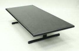 A metal framed granite-topped coffee table