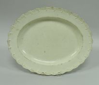 A late 18th Century Leeds cream ware platter with scrollwork decorated border, 39.5 cm x 31.