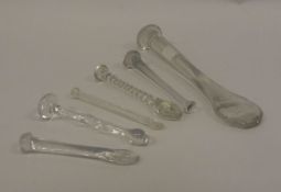 A collection of six various 19th Century glass suger crushers