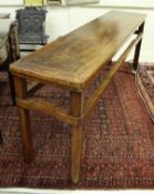 A Chinese cherrywood altar table, the plain top on shaped supports united by upper stretchers,