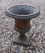 A set of four modern cast iron garden urns of campana design in the Victorian style,