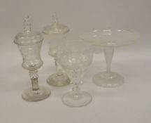 A pair of 19th Century Bohemian clear cut glass goblets of thistle form decorated with running