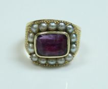 An early 19th Century gold seed pearl and amethyst set mourning ring,