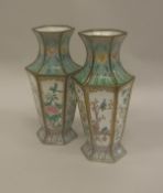 A pair of Chinese enamelled vases of faceted hexagonal form,