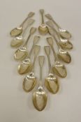 A set of twelve Victorian silver "Fiddle and Thread" pattern dessert spoons,
