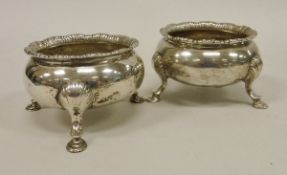 A pair of 19th Century Irish silver cauldron salts of typical form with gadrooned edge and raised