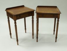 A pair of Edwardian style rosewood side tables each with one drawer to fluted and tapered legs,