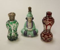 Two Victorian overlaid cut glass scent bottles one in green one in ruby,