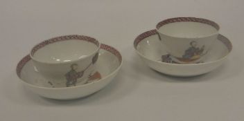 A pair of 18th Century Chinese porcelain tea bowls polychrome decorated with woman seated being