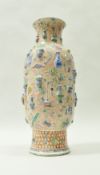 A 19th Century Chinese polychrome decorated vase, decorated in relief with household objects,