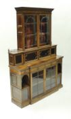 A late Victorian rosewood breakfront bookcase by Howard & Sons of London,