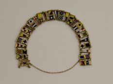 An un-marked gold and enamel Semaphore bracelet featuring various enamelled flags and each engraved