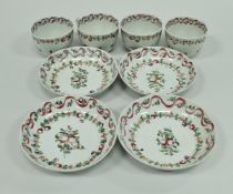 A set of four late 18th Century Newhall porcelain cups and saucers with floral spray and ribbon