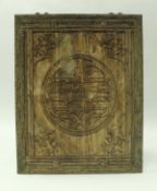 A 19th Century Chinese cherrywood and carved wall panel decorated with central medallion and bats