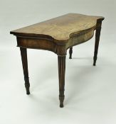 A George III mahogany serving table, the segmented top of starburst form,