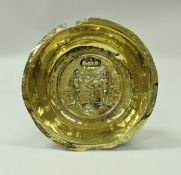 A 17th Century Nuremberg brass bowl the centrefield decorated with Adam and Eve with the serpent