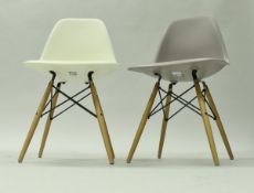A set of four Vitra bucket seat chairs after the original design by Charles and Ray Eames (three