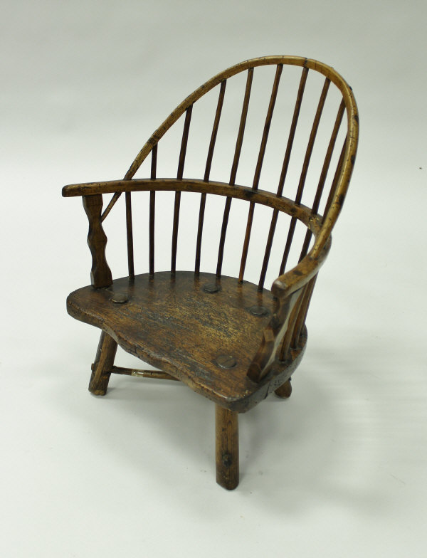 An early 19th Century ash and elm West Country childs stick back chair 51cm high