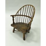 An early 19th Century ash and elm West Country childs stick back chair 51cm high