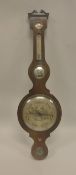 A 19th Century rosewood cased banjo barometer thermometer with silvered dials and central convex
