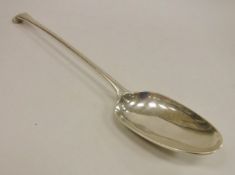 An 18th Century silver basting spoon, "Onslow" pattern, with crest of gryphon and sword to reverse,