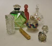 A collection of seven white metal and brass mounted Eastern scent bottles,
